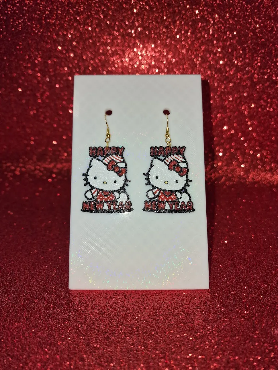 Hello kitty happy new year earrings view 2