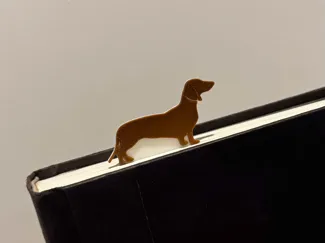 Miniature Dachshund over page Bookmark