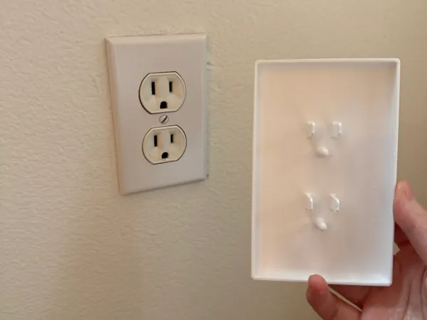 Cache pour prise électrique standard US