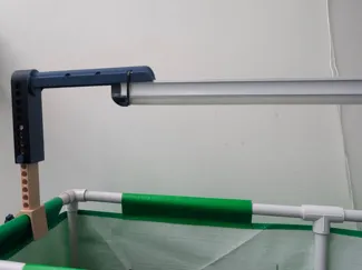 Grow light mount with height adjuster.