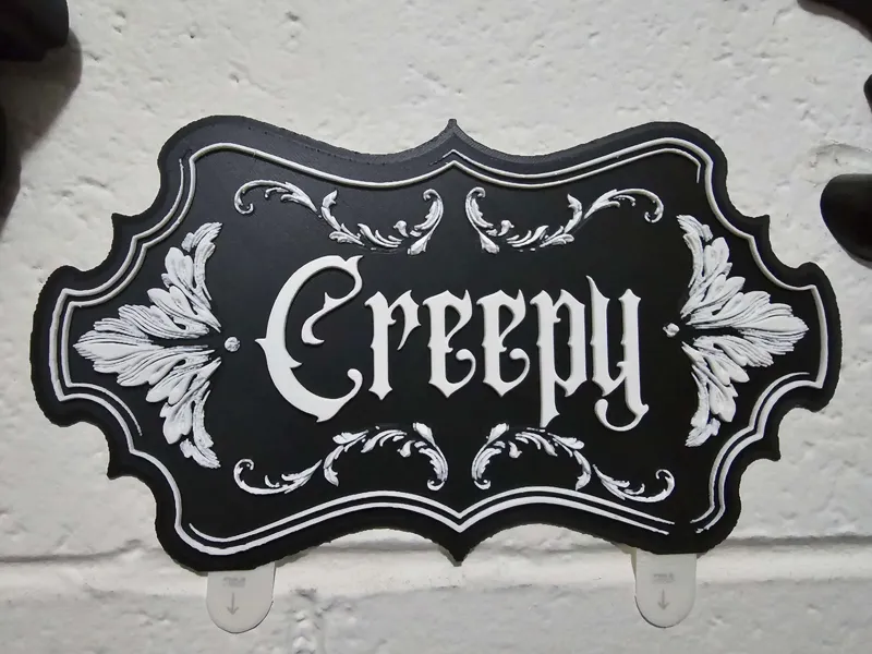 Creepy wall decor sign