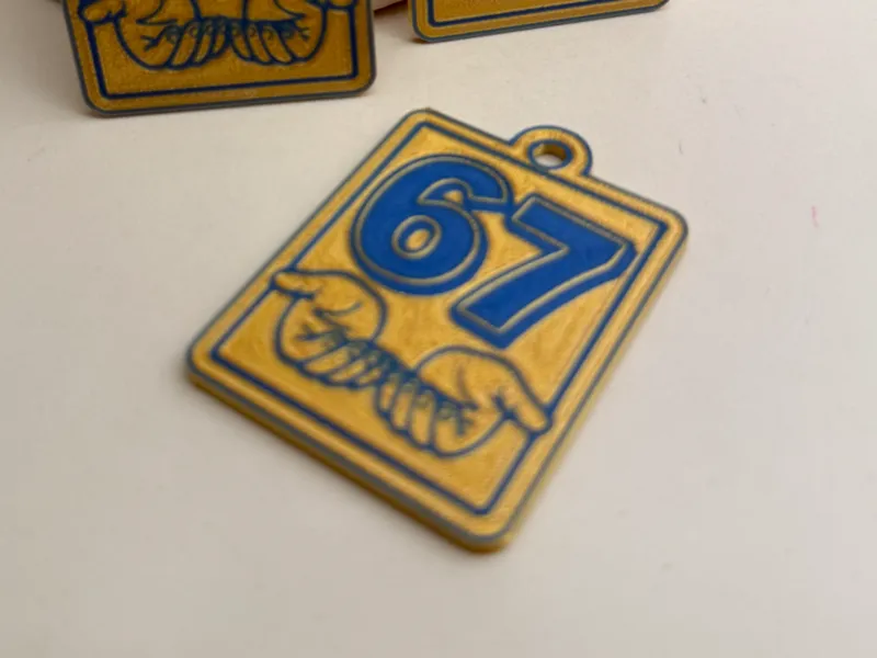 67 Hands Keychain – Gold Background | Bold Number