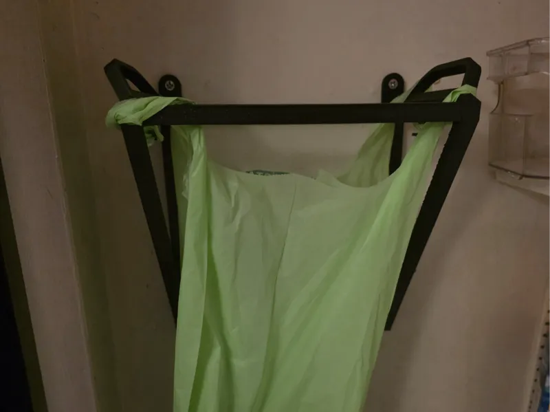 Wall mounted trash bag holder