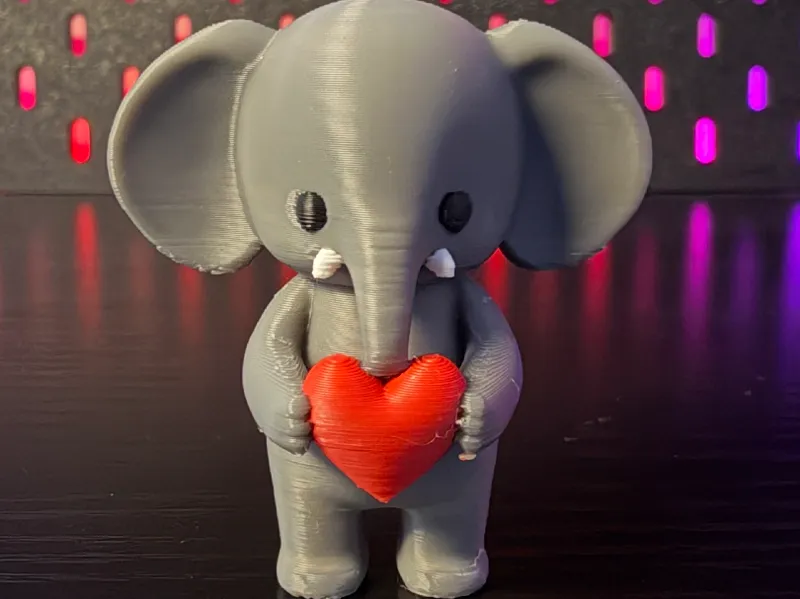 Cute Elephant Holding a Heart