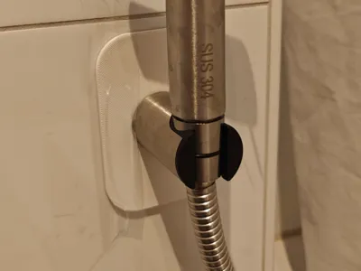 Wall plate for bidet shower