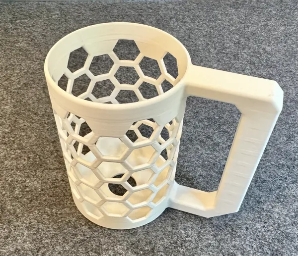 Empty hex pattern soda can holder showing structure