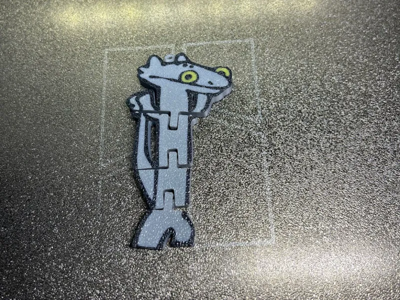 Flexi dancing dragon with keychain loop.