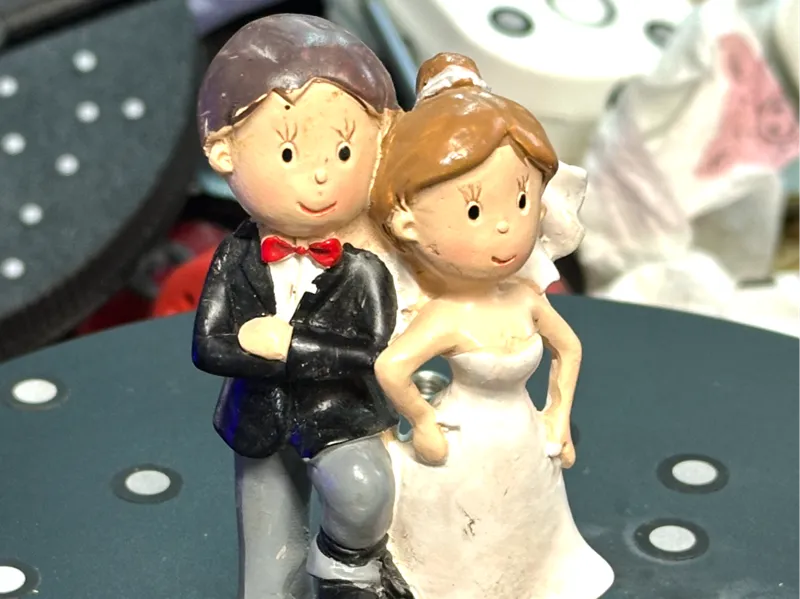 Bride and groom wedding cake topper