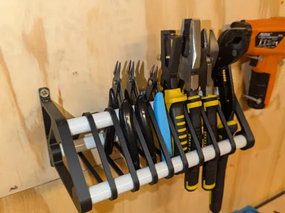 Wall mounted plier holder