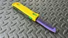 Comb blade wtih bold pattern on expanded handle.