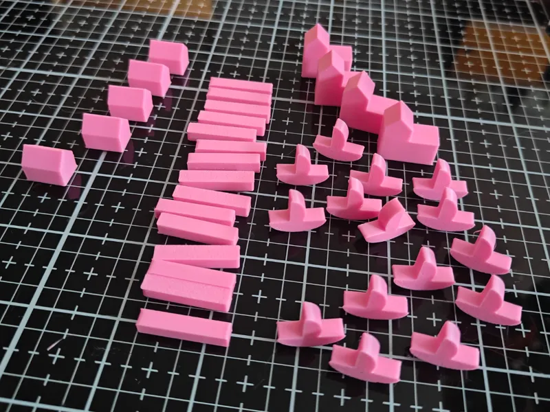 Catan pieces including boats