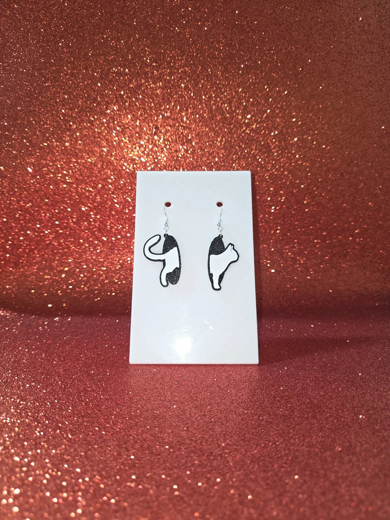 Cat in the hole earrings view 2
