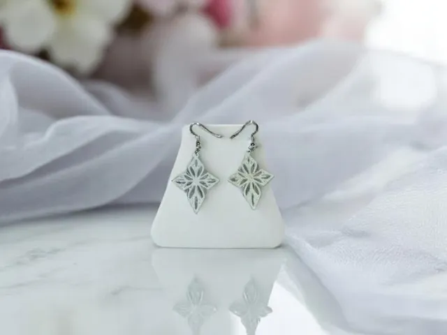 White cross earrings