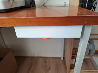 Under-desk twist drawer