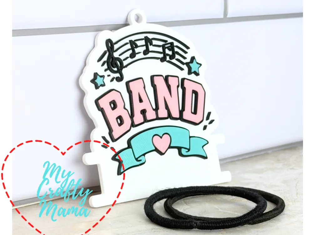 Accesorio para sujetar ligas de cabello: Band School Hair Tie Key chain. Referencia del modelo original.