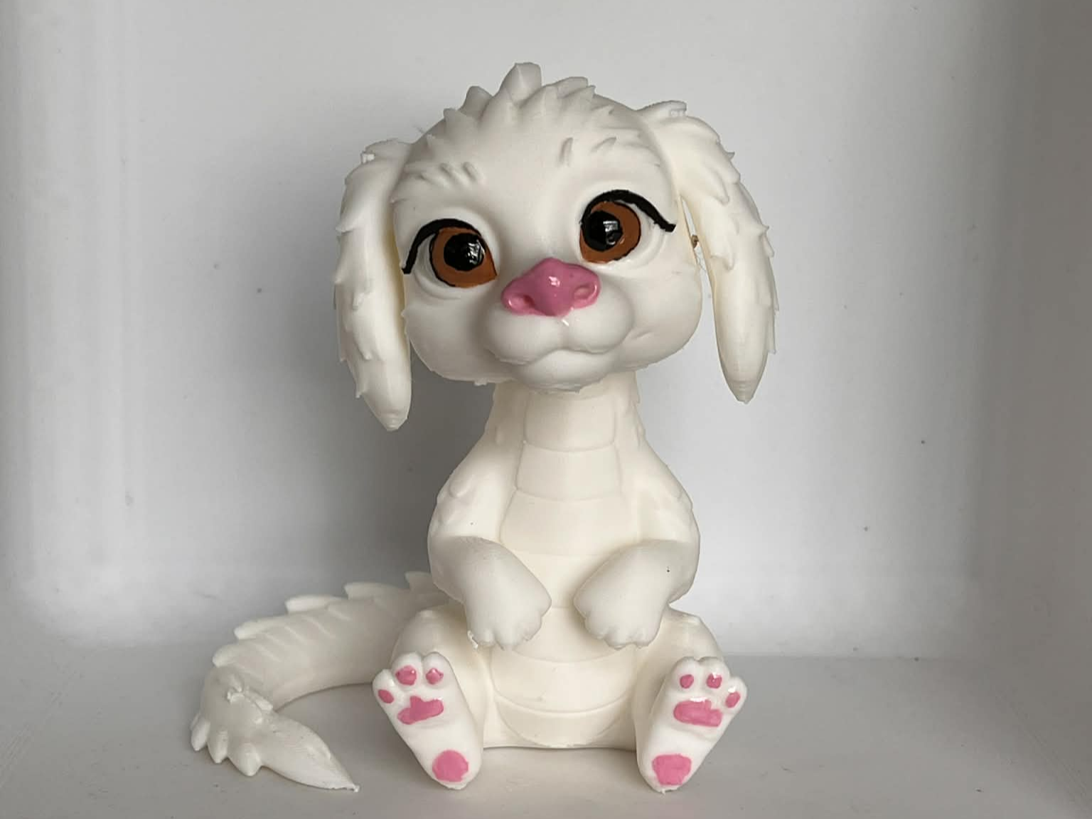 Falkor Sitting  up chibi 