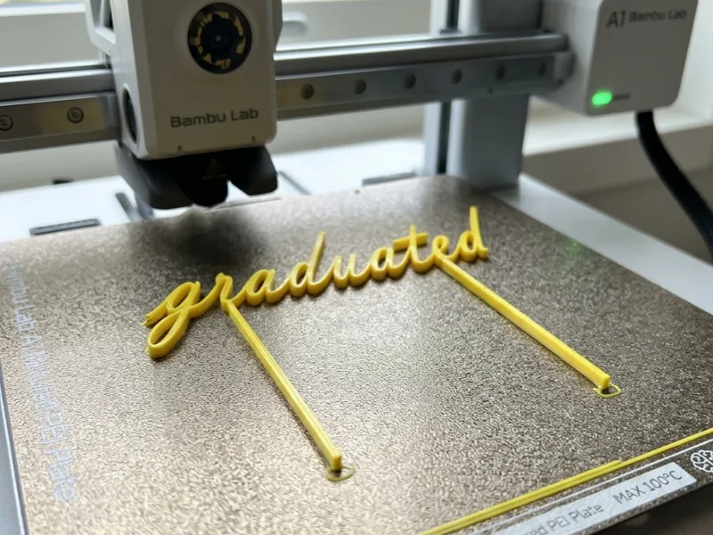 Graduated text cake topper for graduation events
