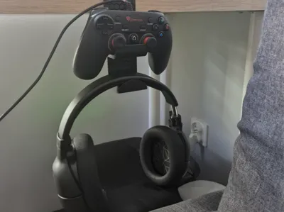 headphones and controller holder mounted to desk