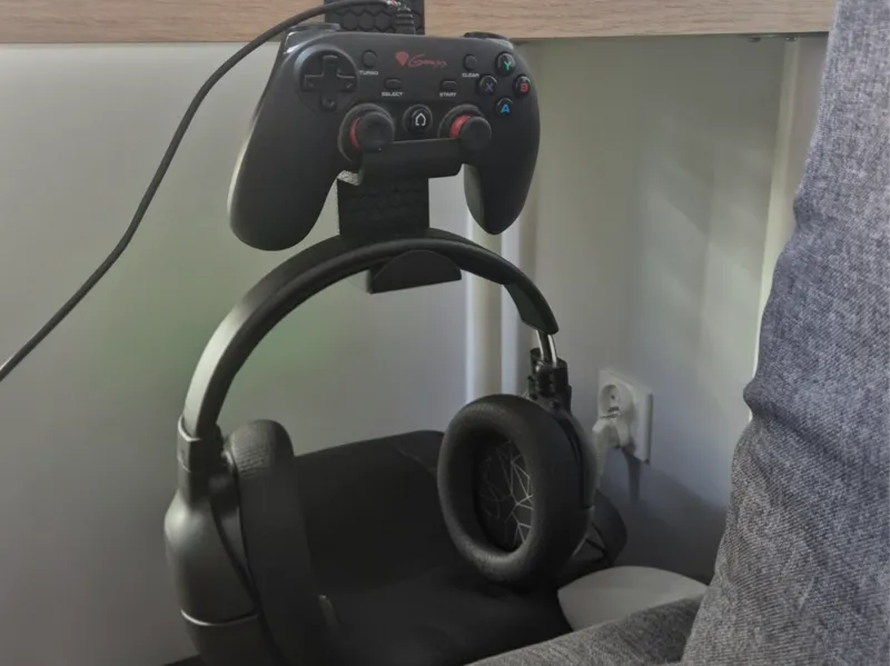 headphones and controller holder mounted to desk