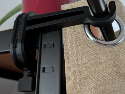 Curtain rod holder with clamp