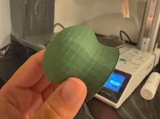 Surfboard wax scraper