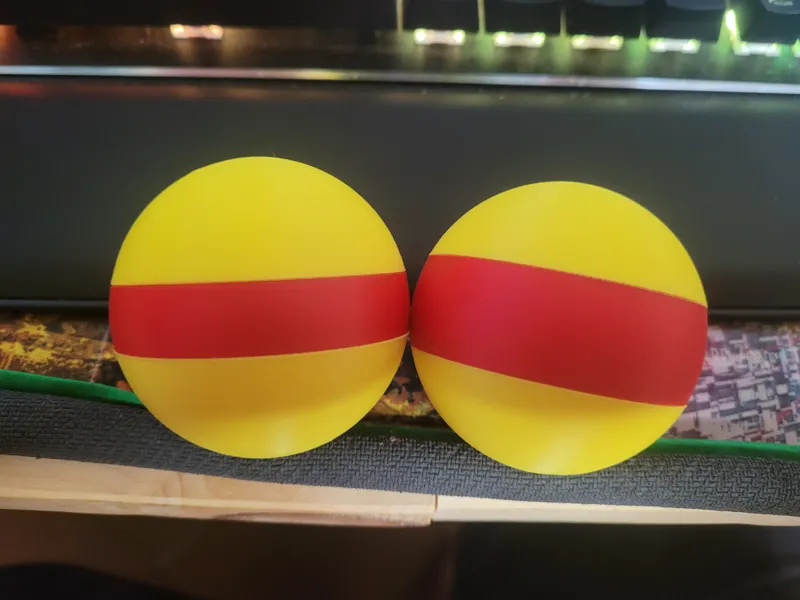yellow ball with red stripes