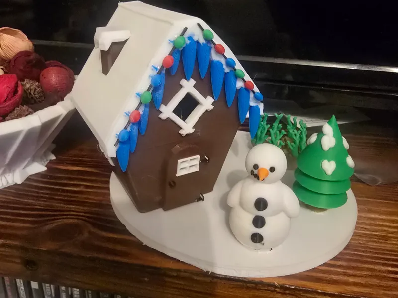 snowman chocolate tea light house