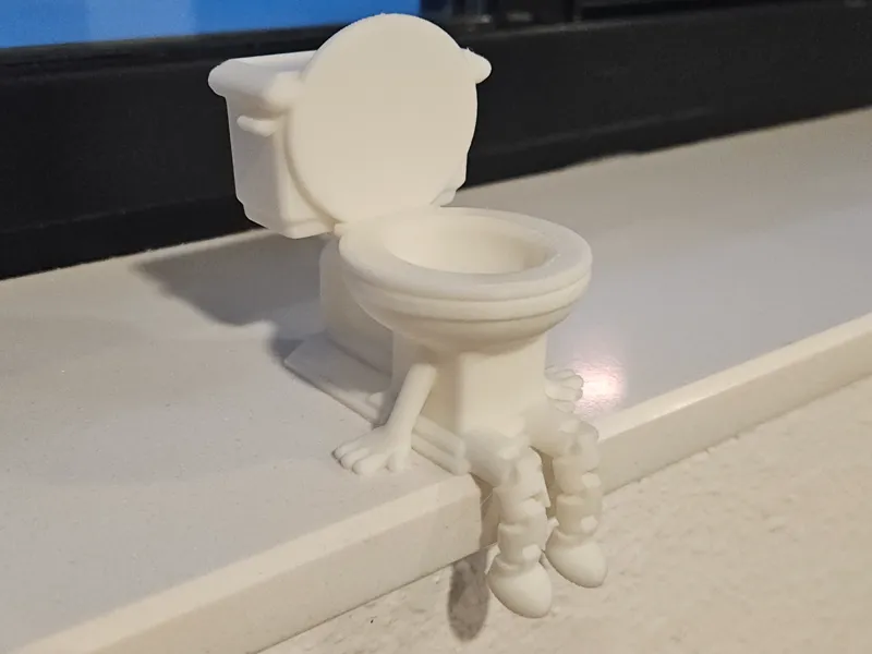 Toilet Buddy with articulated legs