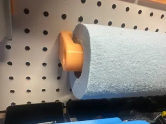 Blue shop paper towel roll pegboard hanger