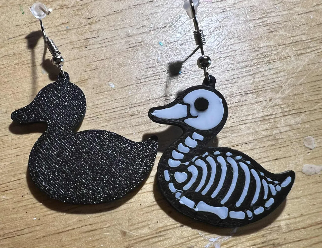 skeleton duck earrings view 2