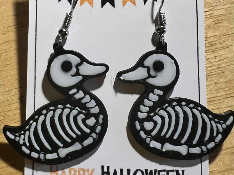 skeleton duck earrings