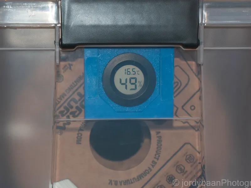 Hygrometer holder for storage box