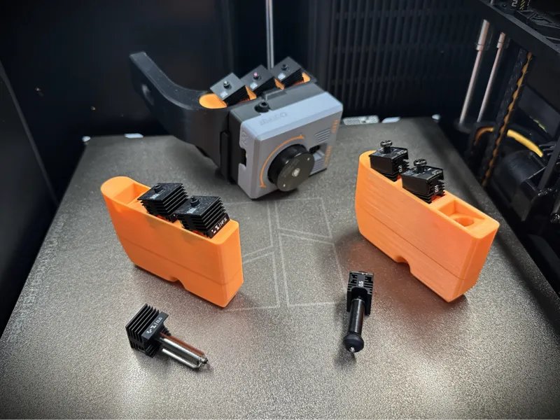 Nozzle Storage for MIM TPU Feed Assist System