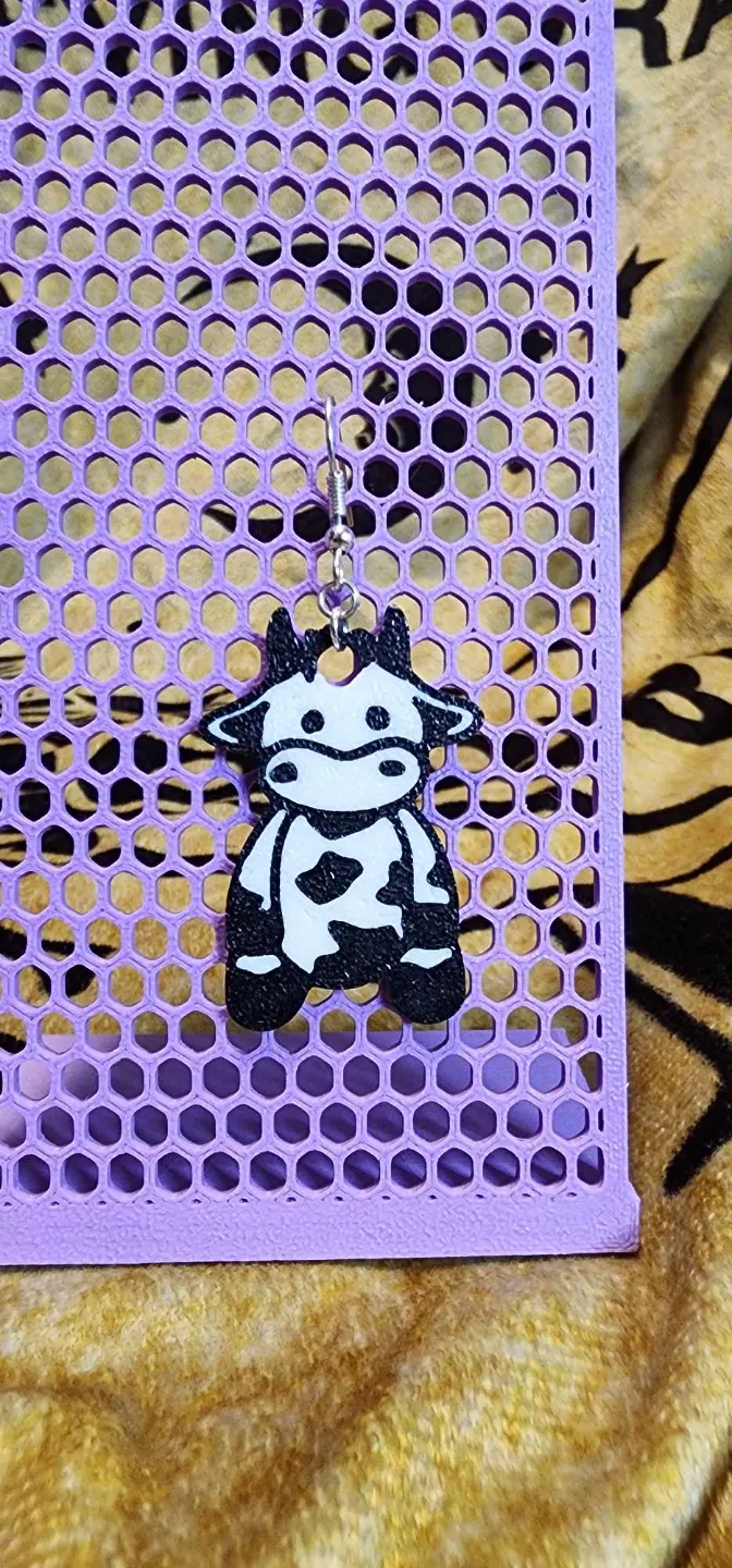 Sitting cow earrings view 3