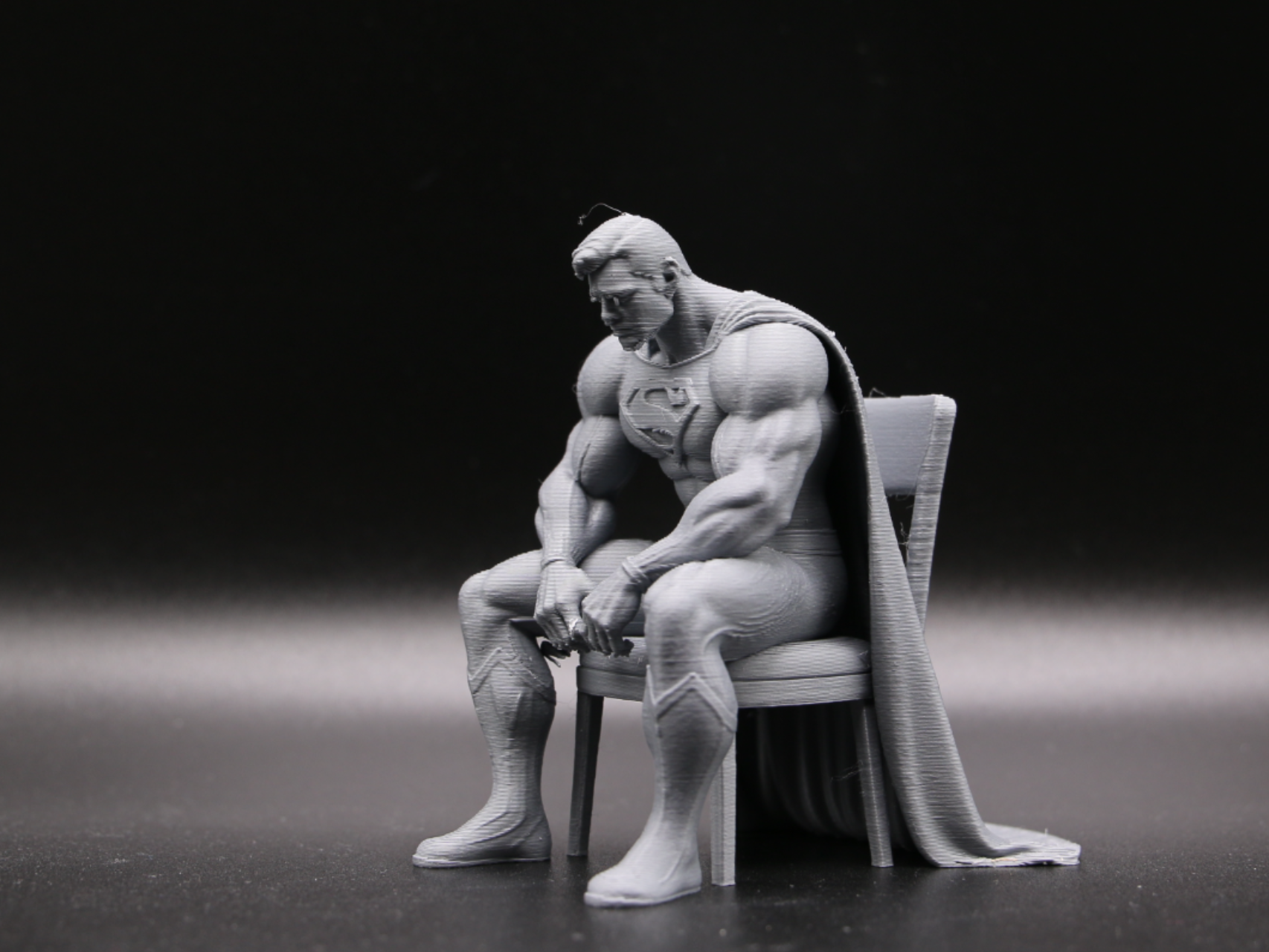 Superman Sitting on a Chair