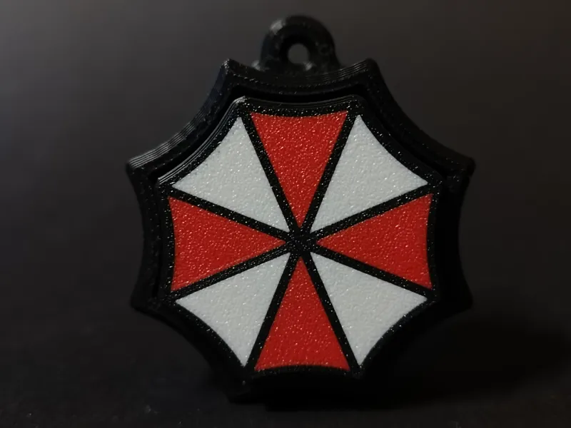 Resident evil umbrella keychain clicker