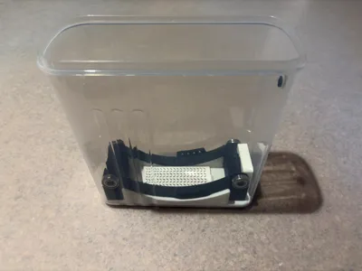 Spool Rotation Adapter for Skroam Container