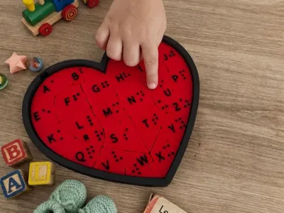Educational puzzle with braille touch