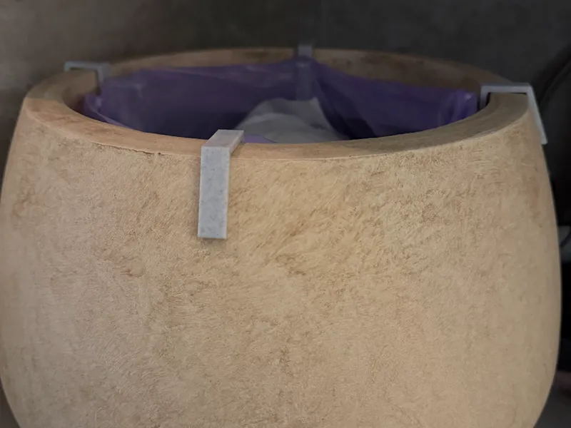 Hook for plastic bag/liner in a plant pot