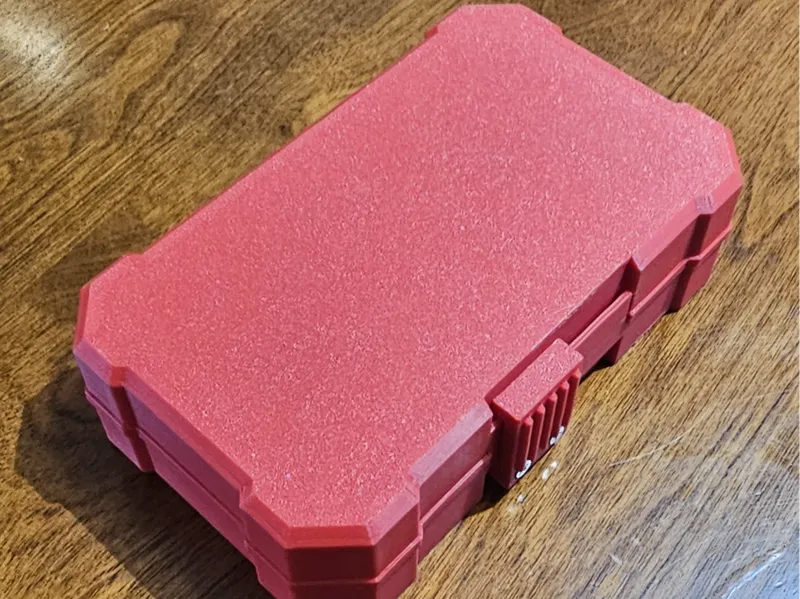 Box with sliding latch