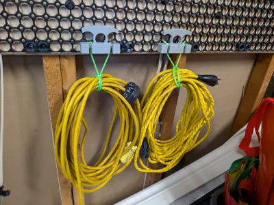Multiboard extension cord holder