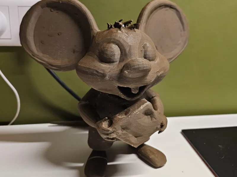 A cute mouse holding cheese