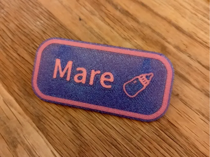 Name tag "MARE" with milk bottle