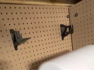Pegboard paper towel roll quick change
