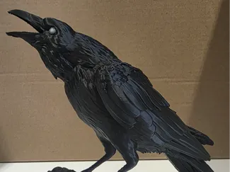 Realistic raven on a stick model