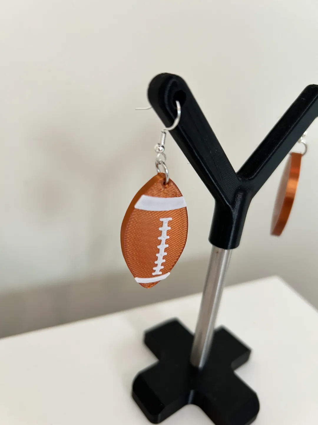 Rugby ball earrings view 2