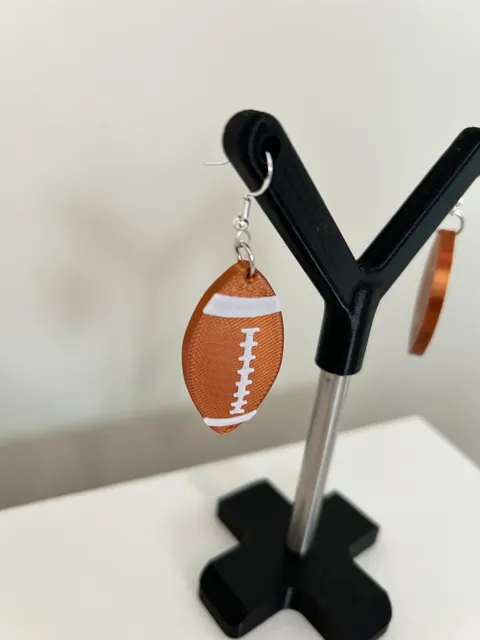 Rugby ball earrings view 2