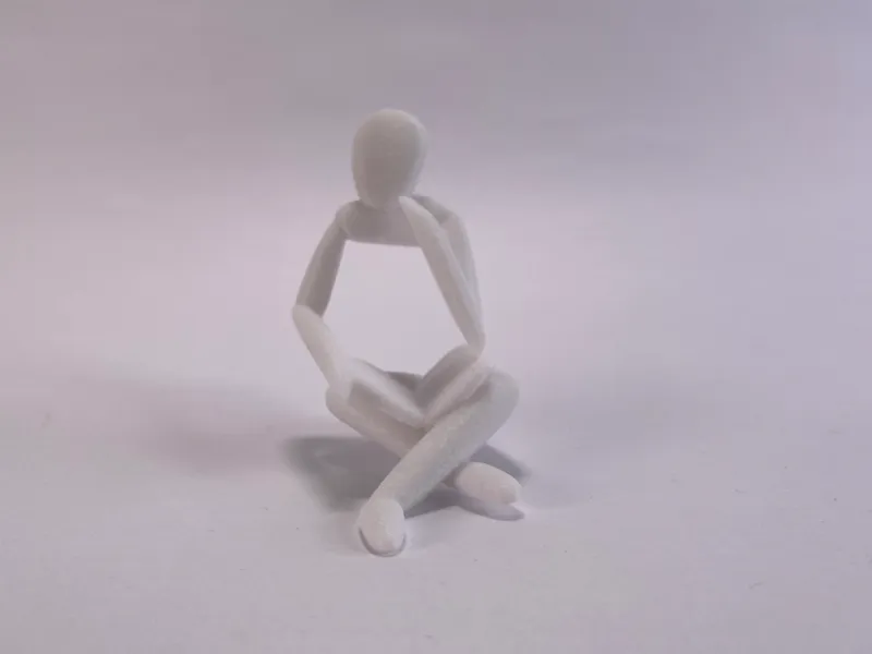 Human Figurine - reading and thinking