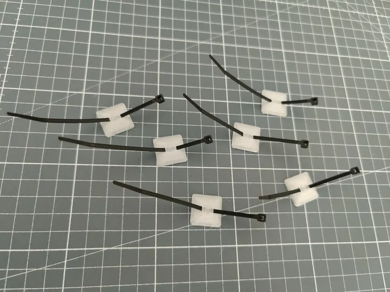Minimalistic cable tie adhesive mount