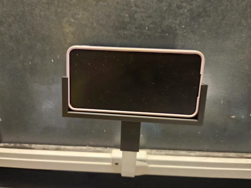 Apoio de celular para janela de banheiro